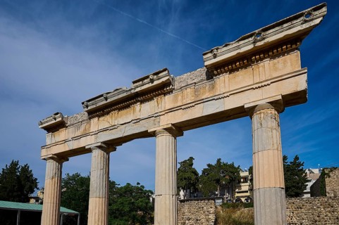 Close-up of ancient column ruins against a clear blue sky, Archaeological Site, Xysto Columned