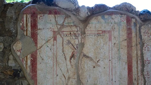 Damaged ancient fresco with pale colours and cracks in a ruin, Archaeological site, Messenger,