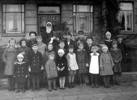 Group of children Father Christmas, 1930, Group of children with a disguised Father Christmas in
