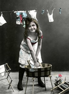 Girl at the washboard, 1920, Girl washing clothes in a wooden bucket, in the background more