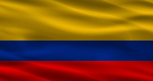 Colombian flag with fabric texture. Realistic flag of Colombia waving