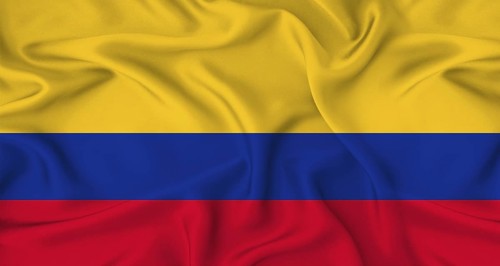Realistic Colombia flag waving. Close up of flag of Colombia with cloth texture