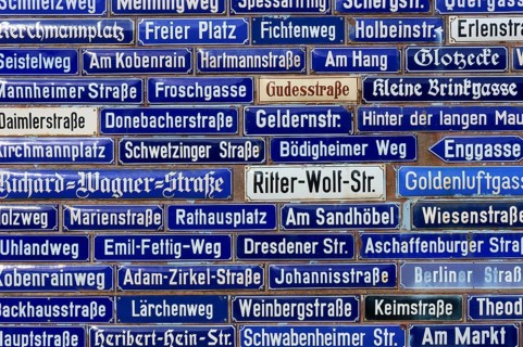 Collection of blue street signs with different street names, Amorbach, Odenwald, Bavaria, Germany