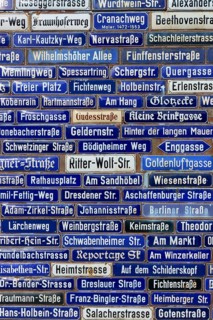 Compact collection of blue street signs with numerous street names, Amorbach, Odenwald, Bavaria,