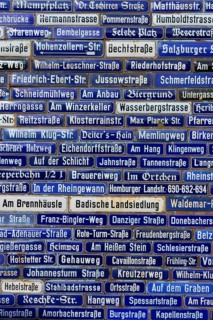 Blue street signs with a variety of names, Amorbach, Odenwald, Bavaria, Germany