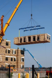 Detroit, Michigan - Workers use modular construction methods to build apartments for low to