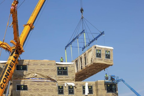 Detroit, Michigan - Workers use modular construction methods to build apartments for low to