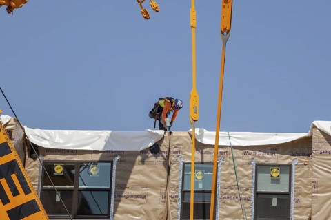 Detroit, Michigan, Workers use modular construction methods to build apartments for low to moderate