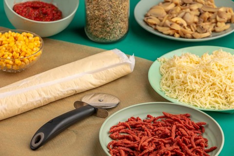Ingredients such as bacon, cheese, mushrooms, sweetcorn and dough