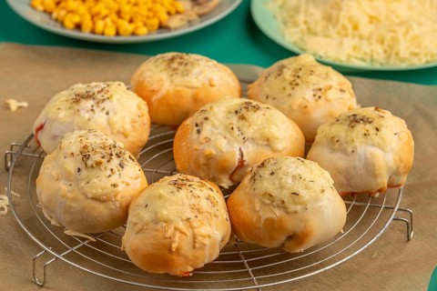 Freshly baked pizza, balls on a grid, ready to cool