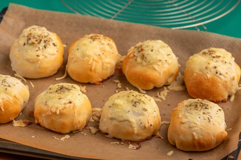 Baked pizza, balls with melted cheese, fresh from the oven