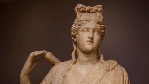 Close-up of the head of a sculpture depicting Artemis with typical hairstyle, Archaeological