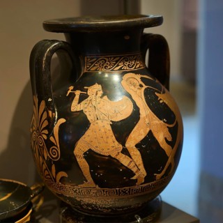 Antique vase depicting two warriors fighting in black and red, Amazonian battle, Antimacheia,