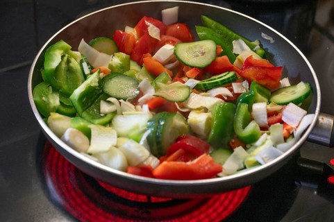 Fresh vegetables in the pan on the cooker, Bavaria, Germany