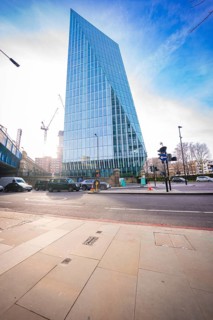 Modern glass building that stands out in the city for its unique architecture, London, United