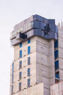 Partially finished high-rise building under construction with modern architectural design, London,