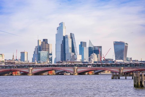 Skyscrapers and a bridge along a river, clear urban skyline, London, United Kingdom, World