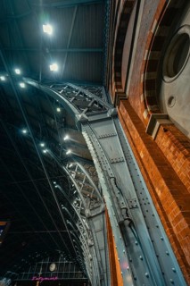 Detailed view of an architectural arch made of steel and brick with industrial flair, London,