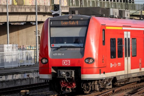 Train on the line, platform tracks in front of Cologne-Messe/Deutz station, S-Bahn, empty journey