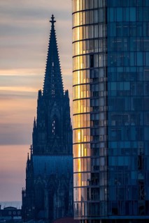 Cologne Cathedral, church towers, round façade of the Cologne Triangle Hochaus in Cologne-Deutz,
