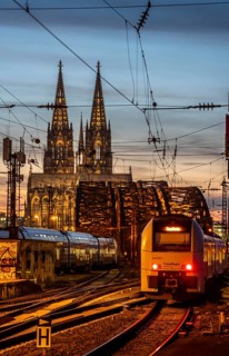 Rail track in front of Cologne Central Station, Hohenzollern Bridge across the Rhine, regional