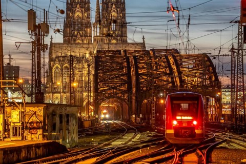 Rail track in front of Cologne Central Station, Hohenzollern Bridge across the Rhine, regional