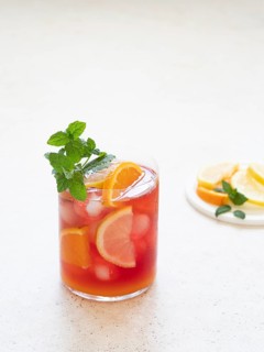 Cold fruit punch with orange, lemon, and mint garnish