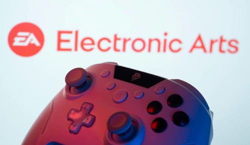 Dhaka, Bangladesh- 24 Mar 2025: A close-up of a gamepad with the Electronic Arts seen on screen in