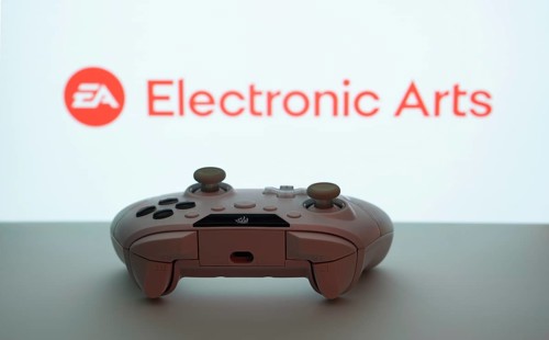 Dhaka, Bangladesh- 08 Apr 2025: A gaming controller in front of a Electronic Arts screen