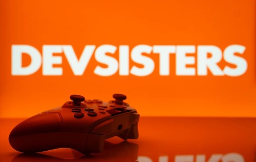 Dhaka, Bangladesh- 20 Mar 2025: A close-up of a white gamepad with the Devsisters seen on screen in