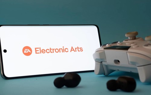 Dhaka, Bangladesh- 23 Mar 2025: A smartphone with a Electronic Arts icon next to a controller and