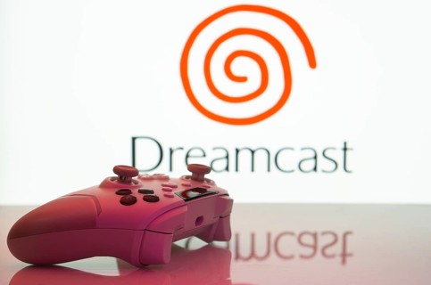Dhaka, Bangladesh- 20 Mar 2025: A close-up of a white gamepad with the Dreamcast seen on screen in