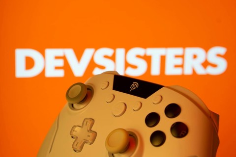 Dhaka, Bangladesh- 20 Mar 2025: A close-up of a gamepad with the Devsisters seen on screen in the