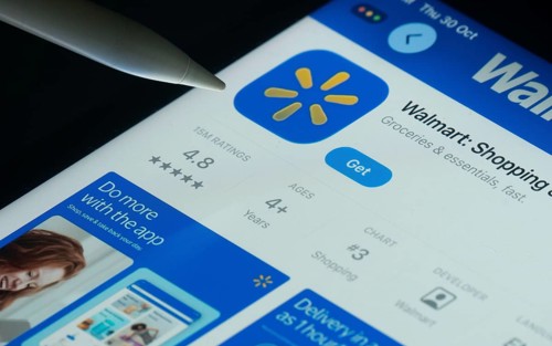 Dhaka, Bangladesh- 30 Oct 2025: Walmart app on a iPad screen with a pen pointing at the install