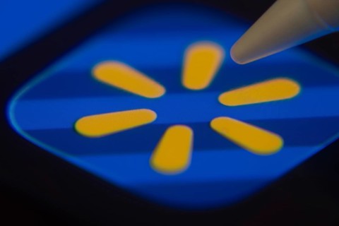 Dhaka, Bangladesh- 06 Dec 2025: Close-up of the Walmart app on a screen with a stylus pointing at
