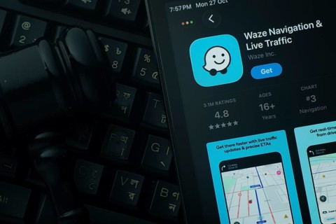 Dhaka, Bangladesh- 28 Oct 2025: An iPad displaying the Waze app against a judge's gavel and dark