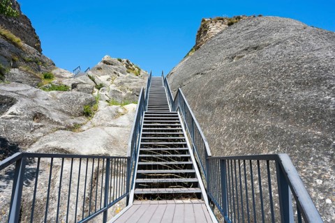 Rocky landscape with stairs and bright blue sky, Uplistsikhe cave town, Uplistsikhe, Inner Kartli