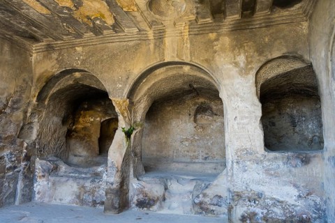 Ancient cave with stone arches and interior details, historic setting, Tamaris Darbasi, Tamaras