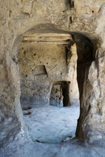 Weathered cave interior with uneven stone walls, cave town Uplistsikhe, Inner Kartli region, Shida