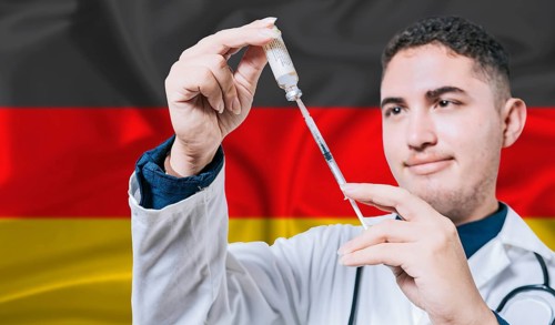 Doctor holding syringe on Germany flag background. Medical professional holding syringe with German