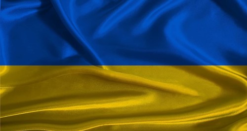 Ukraine flag with cloth textured background. National flag of Ukraine with realistic texture