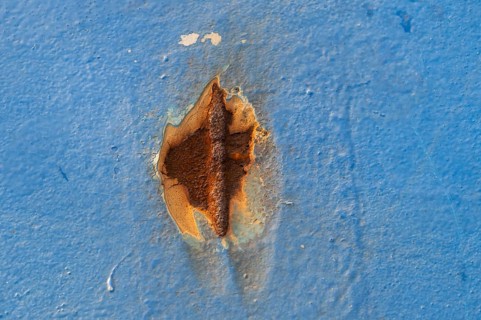 Rust spot on blue painted wall, Finland ferry Helsinki to Travemünde, chimney and loading area,