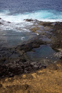 Coastal scene with rocks and waves hitting the cliffs. Dynamic natural scenery, Yaiza Lanzarote