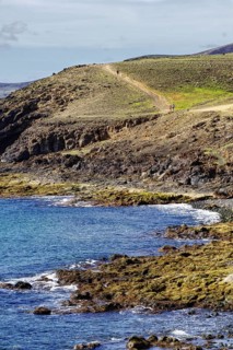 Coast with rugged hills and a hiking trail that snakes through the countryside, Puerto Calero