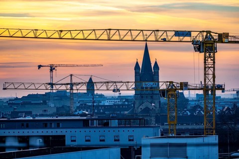 View of downtown Cologne, construction cranes from various construction sites, tower of Groß St.