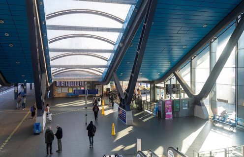 View from escalator of modern architecture of railway station concourse building, Reading,