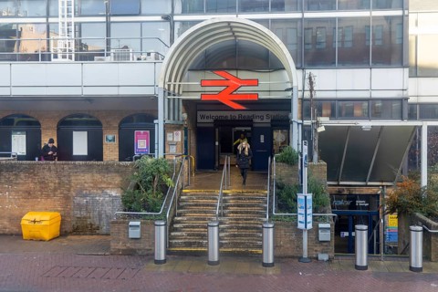 Staircase leading to entrance and sign Welcome to Reading Station railway station, Reading,
