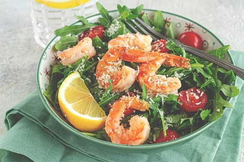 Shrimp salad with arugula and cherry tomatoes, with parmesan cheese, healthy food