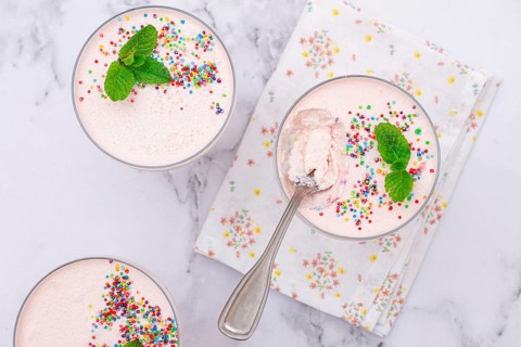 Fruit mousse, made from jelly and cottage cheese, in glasses, decorated with sprinkles and mint,