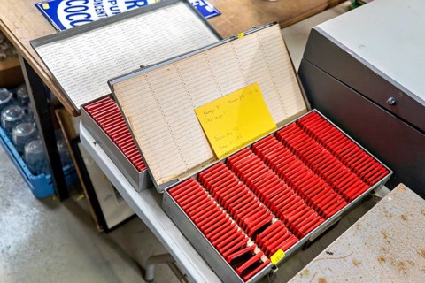 Metal slide storage boxes with vintage 35mm film transparency slides at auction, UK